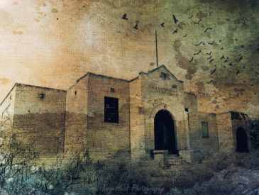 Artistic textured photo of the abandoned school in Escondida, New Mexico.