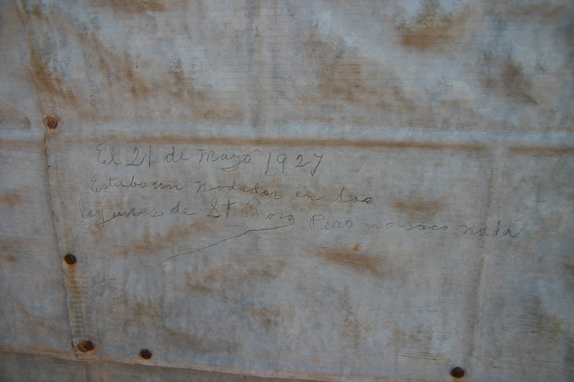 Writing on the wall of the Hawkins building in Cuervo, New Mexico.