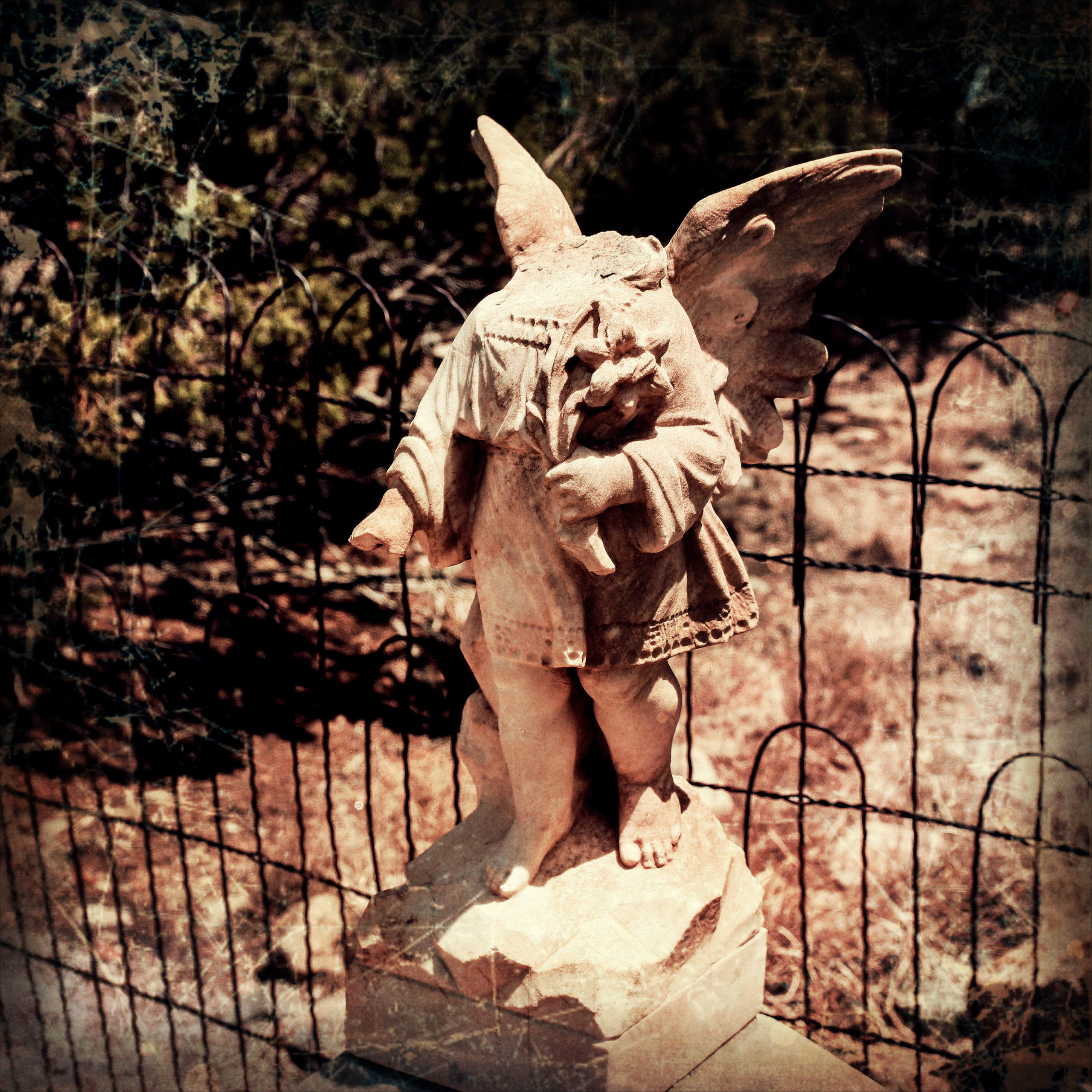 Headless angle statue in the Land of the Dead Cemetery in Madrid, New Mexico.
