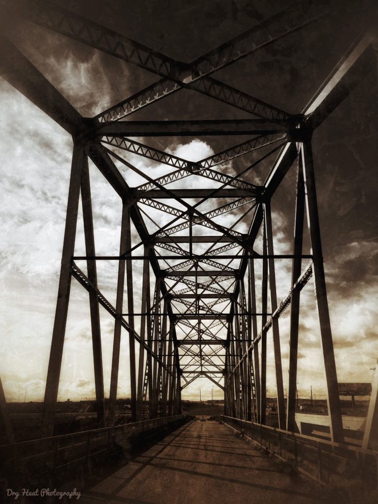 The Rio Puerco Bridge is a Parker Through Truss style bridge and was fabricated by the Kansas City Structural Steel Company