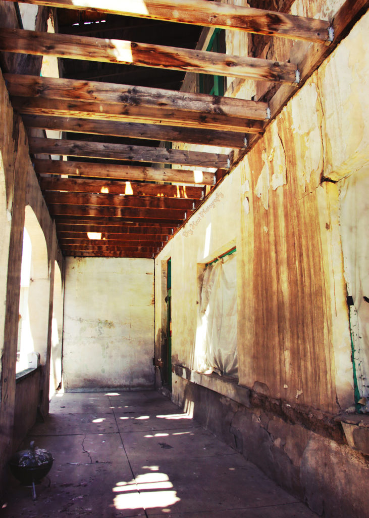Front porch of the Abandoned Kuhn Hotel in Belen, New Mexico.