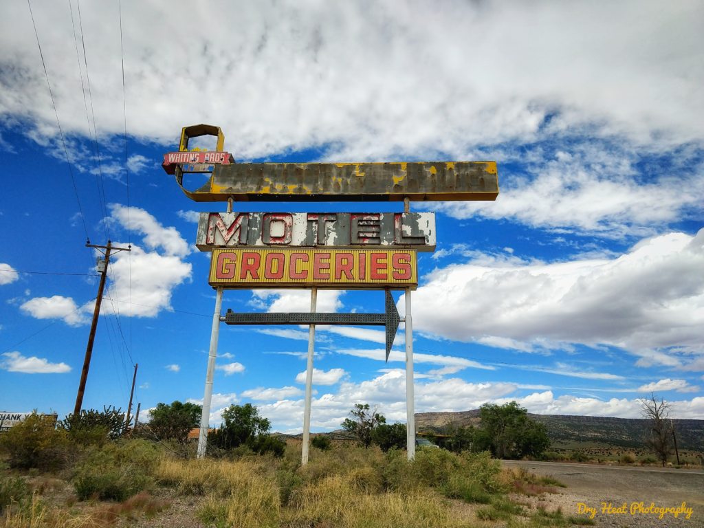Vintage sign in front of the abandoned Whiting Bros Gas Station on Route 66 near Grants, New Mexico.