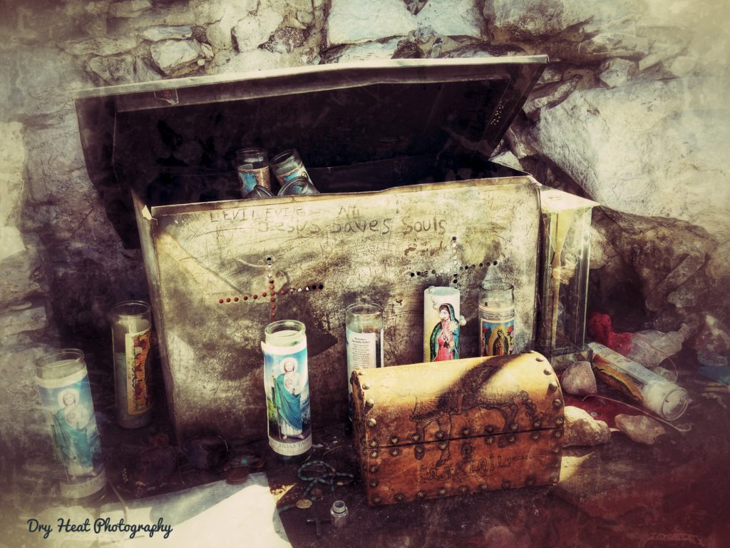 Candles and other religious offerings left behind at the top of Tome Hill in Tome, New Mexico.