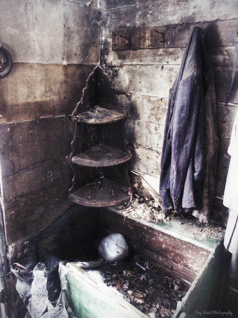 Coats still hang on the wall of this abandoned house in Navarino, Wisconsin.