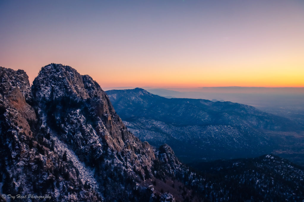 A view to the north of snowy Sandia Mountains as seen from the tram.