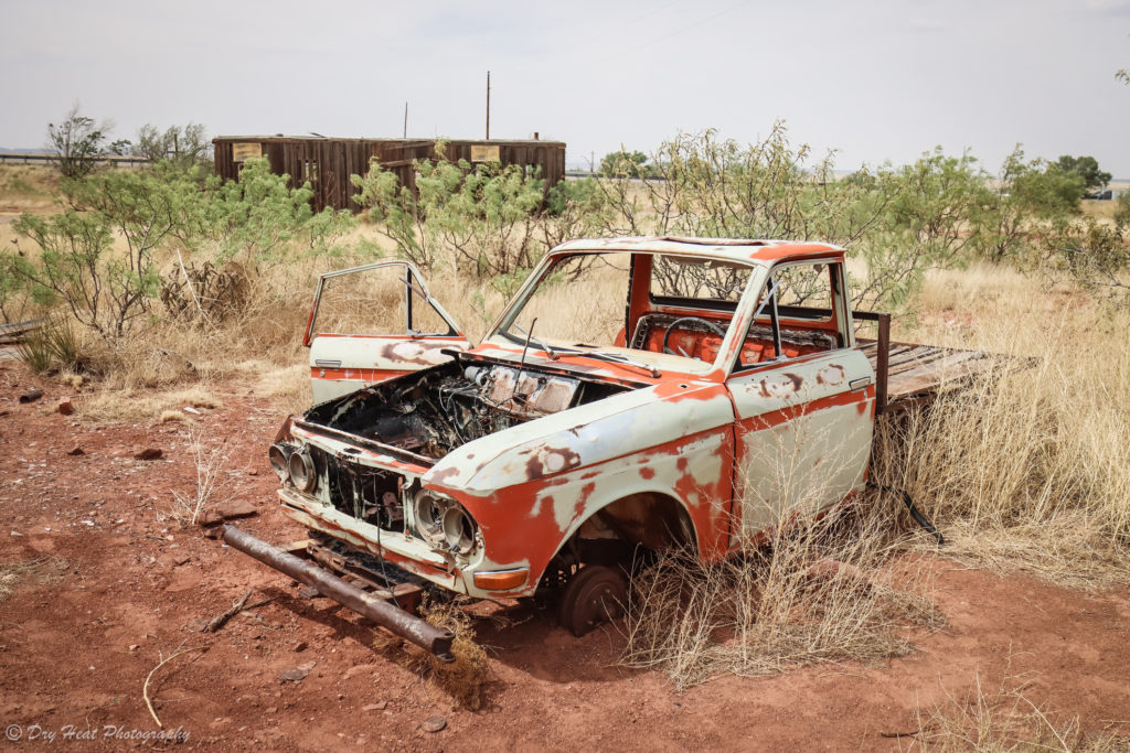 Abandoned Datsun pickup truck in the Route 66 ghost town of Cuervo, New Mexico.