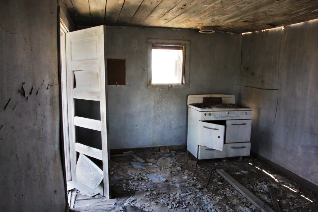 Old stove inside an abandoned house in Cedarvale, New Mexico