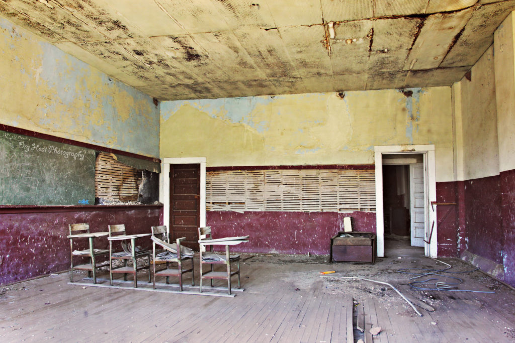 Classroom with desks at the abandoned Cedrvale School in Cedarvale, New Mexico