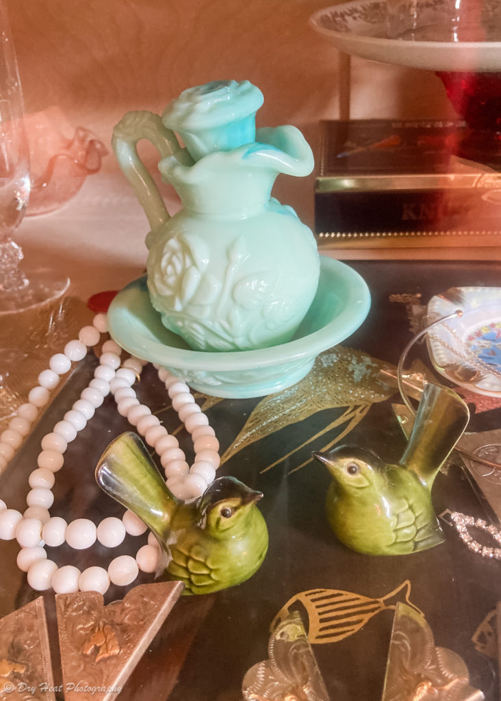 Green milk-glass and vintage bird sculptures at Swansong at the El Vado Motel in Albuquerque, New Mexico.